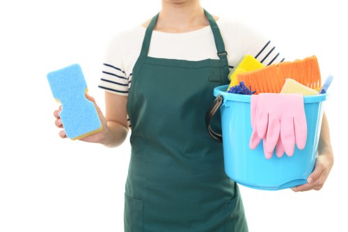 Professional cleaners tidying an office space in Arnos Grove