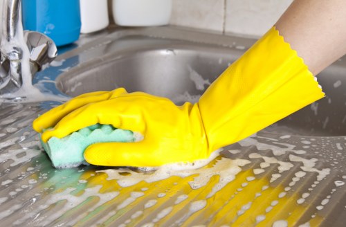 Professional cleaner handling delicate fabrics at Arnos Grove